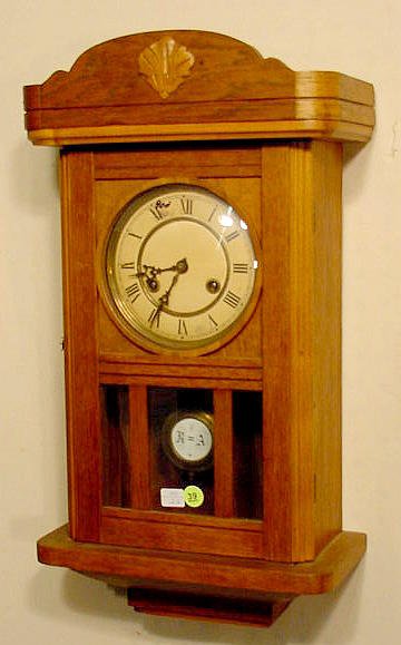 Junghans walnut hanging clock: — Antique Clocks Price Guide