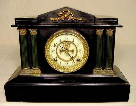 Ansonia iron case column clock: — Antique Clocks Price Guide