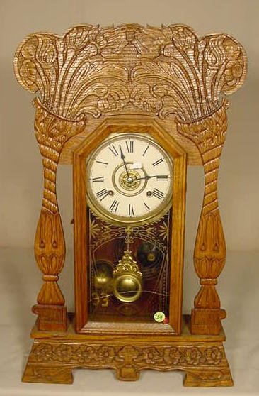 Pressed oak parlor clock. — Antique Clocks Price Guide