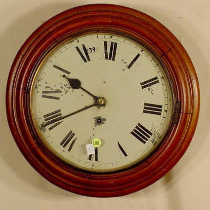 Round walnut gallery clock: — Antique Clocks Price Guide