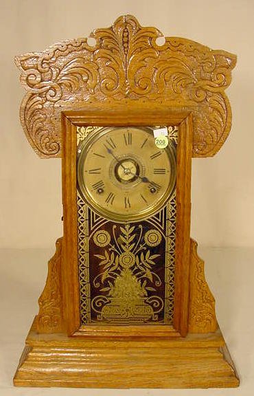 Gilbert pressed oak kitchen clock. — Antique Clocks Price Guide