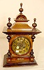 Walnut & mixed wood bracket style clock:
