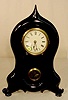 Iron front 8 day shelf clock. 