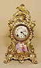 Ansonia silver plated [?] metal case clock 