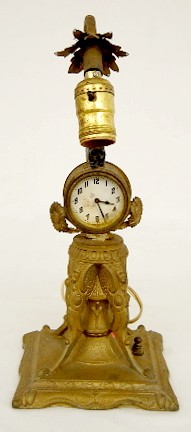 Metal Clock Lamp w/ Bear and Winged Figures — Antique Clocks Price Guide