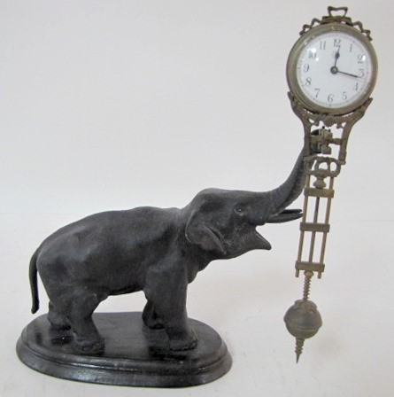 Junghans Black Elephant Swinger Clock — Antique Clocks Price Guide