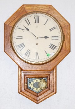Oak Waterbury Short Drop Schoolhouse Clock — Antique Clocks Price Guide