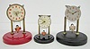 3 Oriental Swinger Dome Clocks