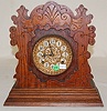 Ansonia "Penton" Oak Carved Cabinet Clock