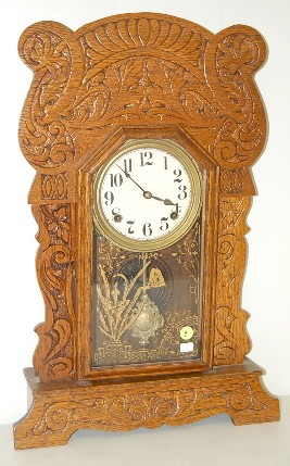 Pressed Oak Dolphin Kitchen Clock — Antique Clocks Price Guide