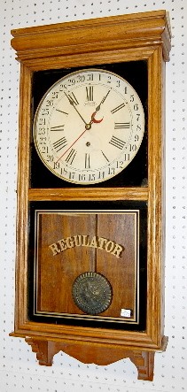 Ingraham Oak Calendar Store Regulator Clock — Antique Clocks Price Guide