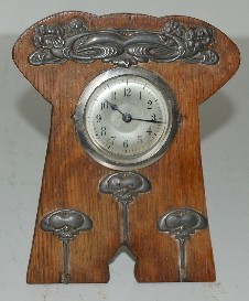 Small Oak and Metal Floral Clock — Antique Clocks Price Guide