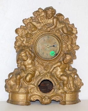 Antique Iron Clock w/ Cherubs and Grapes — Antique Clocks Price Guide