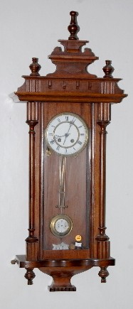 Carved RA Wall Hanging Clock — Antique Clocks Price Guide