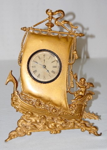 Metal Novelty Ship &amp; Cherub Dresser Clock — Antique Clocks Price Guide