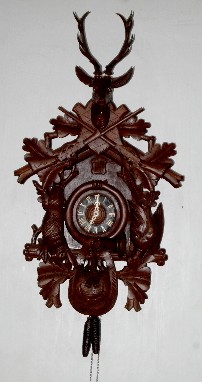 Black Forest Game Carved Cuckoo Clock — Antique Clocks Price Guide