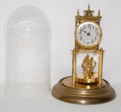 Disk Pendulum Anniversary Dome Clock — Antique Clocks Price Guide