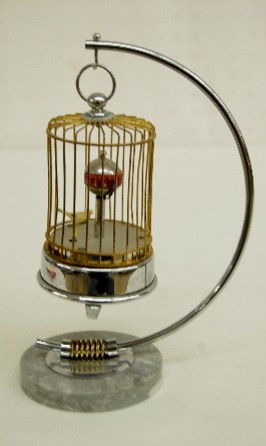 Chrome &amp; Gilded Animated Bird in Cage Clock — Antique Clocks Price Guide