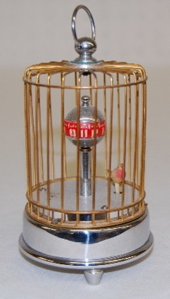 Chrome and Gilded Animated Bird in Cage Clock — Antique Clocks Price Guide