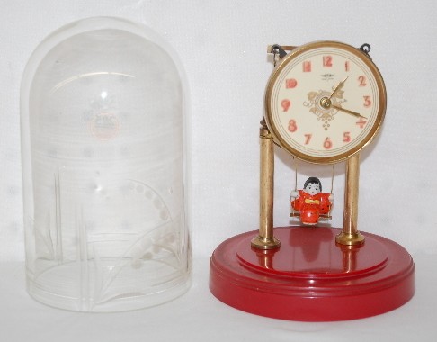 Swinging Doll Dome Clock — Antique Clocks Price Guide
