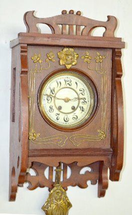 Art Nouveau Free Swinger Wall Clock — Antique Clocks Price Guide