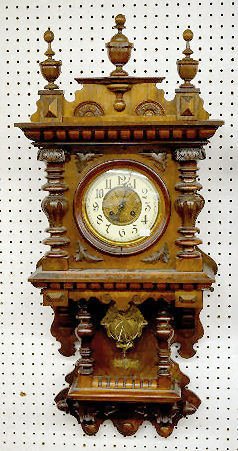 German Carved Free Swinger Wall Clock — Antique Clocks Price Guide