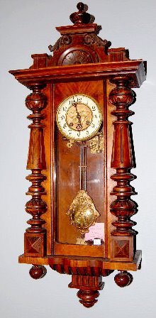 German Carved RA Wall Clock — Antique Clocks Price Guide