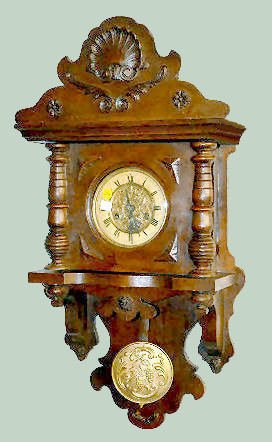 German Carved Free Swinger Wall Clock — Antique Clocks Price Guide