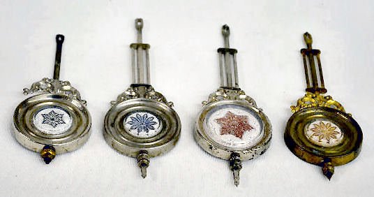 4 Aluminum &amp; Pressed Glass Clock Pendulums — Antique Clocks Price Guide