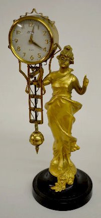 Linden Lady Statue Swing Clock, Painted Lady — Antique Clocks Price Guide