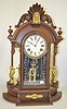 Ansonia "Triumph" Walnut Mirror Side Clock